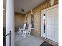 Inviting covered porch with rocking chairs, offering a relaxing spot to enjoy the outdoors at 561 Keystone Nw Ct, Concord, NC 28027