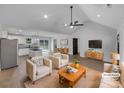 Staged living room and kitchen area featuring modern decor and stainless steel appliances at 733 Baker St, Kannapolis, NC 28081