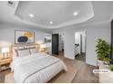 Serene bedroom featuring tray ceilings, recessed lighting, and ensuite bathroom at 733 Baker St, Kannapolis, NC 28081