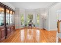 Cozy living room filled with natural light, showcasing hardwood floors and stylish furniture at 821 Lynnwood Farms Dr, Fort Mill, SC 29715