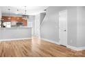 Bright kitchen with modern appliances and warm, wood-look laminate floors at 12417 Mcgrath Dr, Charlotte, NC 28269