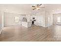 Spacious living room with hardwood floors flowing into an open-concept kitchen at 125 Lightning Dr, Shelby, NC 28152