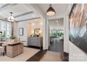 Bright home office with modern furnishings, large windows, and stylish decor at 13217 Oak Farm Ln, Huntersville, NC 28078