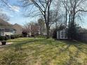 Spacious backyard with a shed, wooden fence, and plenty of space for outdoor activities at 1347 Eisenhower Nw Pl, Concord, NC 28027