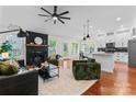 Bright and airy living room with hardwood floors, fireplace, and an open floor plan at 1347 Eisenhower Nw Pl, Concord, NC 28027
