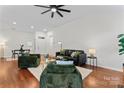 Bright living room features hardwood floors and modern furniture at 1347 Eisenhower Nw Pl, Concord, NC 28027