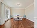 Well-lit office space features hardwood floors, crown molding, and a large bay window at 1525 Autumn Brook Ln # 78, Clover, SC 29745