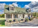 Charming home featuring a cozy porch, dormer windows, and inviting curb appeal at 2331 Gill Jordan Rd, Chester, SC 29706