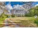Beautiful home surrounded by a large, well-maintained front yard and lush trees at 2331 Gill Jordan Rd, Chester, SC 29706