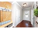 Inviting entryway features custom wood accent wall, storage bench, and a decorative welcome sign at 246 Sweet Briar Dr, Fort Mill, SC 29707