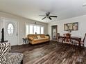 Inviting living room boasts hardwood floors, a large window, and a comfortable sofa at 464 Willetta Nw Pl, Concord, NC 28027