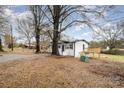 Expansive backyard with mature trees, perfect for outdoor gatherings and relaxation at 5674 Alan D Good Ln, Conover, NC 28613