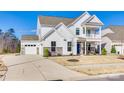 Stunning two-story home with a two-car garage, stone accents, and manicured lawn at 6119 Russo Ct, Lancaster, SC 29720