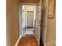 Inviting entryway showcasing a 'Hello' mat and a peek into apartment #20 at 1121 Myrtle Ave # 17, Charlotte, NC 28203