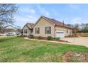 Lovely home with attached garage, well-kept lawn, and mature landscaping at 1278 Gracebrook Dr, Salisbury, NC 28147