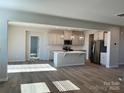 Open kitchen featuring stainless steel appliances, large island, and pendant lighting at 1708 Honey Trl, Monroe, NC 28112
