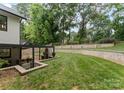 This expansive backyard boasts tiered retaining walls, enhancing the outdoor living experience at 3416 Windsor Dr, Charlotte, NC 28209