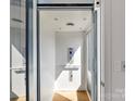 Home elevator featuring modern design and lighting, offering convenient access to all levels at 3416 Windsor Dr, Charlotte, NC 28209