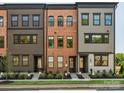 New townhouse exterior featuring three units with varied colors and classic architecture at 408 Old Town Village Rd, Waxhaw, NC 28173