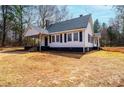 Exterior of a well-kept single-story house with a classic design and landscaped yard at 4221 E Maiden Rd, Maiden, NC 28650