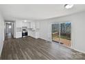 Bright eat-in kitchen with white cabinets, stainless steel appliances, and deck access at 5012 Maplecrest Dr, Gastonia, NC 28056