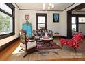 Cozy living room with hardwood floors, lots of natural light, and vintage furniture at 819 Sunnyside Ave, Charlotte, NC 28204