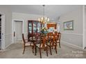 Elegant dining room with classic furnishings and chandelier lighting at 8525 Kilty Ct, Charlotte, NC 28269