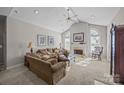 Spacious living room with vaulted ceiling, fireplace, and ample natural light at 8525 Kilty Ct, Charlotte, NC 28269