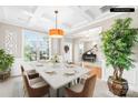 Spacious dining room featuring coffered ceilings, large windows, and elegant decor at 963 Brookdale Ln, Stanley, NC 28164