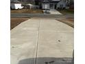 Long, spacious concrete driveway providing ample parking space for multiple vehicles at 1111 Pondella Dr # 66, Charlotte, NC 28213