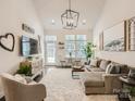 Bright living room featuring modern decor, a comfortable couch, and a walk-out to a patio at 125 Lanyard Dr # E, Mooresville, NC 28117