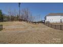 Large, fenced backyard, providing privacy and ample space for outdoor activities and landscaping at 15308 Lake Ridge Rd, Charlotte, NC 28278