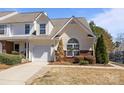 Inviting townhome with neutral siding, well-maintained landscaping, and attached garage in a cozy neighborhood at 1716 Hidden Creek Dr, Rock Hill, SC 29732