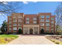 Beautiful brick building with elegant entrance and manicured landscaping offering a sophisticated living experience at 2445 Selwyn Ave, Charlotte, NC 28209