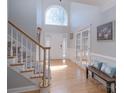 Bright foyer with grand staircase and beautiful hardwood floors at 3304 Taviston Dr, Waxhaw, NC 28173