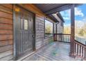 Close-up of the front door with decorative glass and exterior wood trim at 455 Pinhook Loop Rd, Gastonia, NC 28056