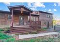 Inviting front entrance with covered porch and stairs, offering a warm welcome at 455 Pinhook Loop Rd, Gastonia, NC 28056