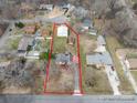 Aerial view showcasing the property with approximate lot lines, surrounding neighborhood, and nearby houses at 5412 Carving Tree Dr, Harrisburg, NC 28075