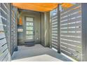 Modern front door with glass panels and a sleek, enclosed entryway at 805 E 19Th St, Charlotte, NC 28205