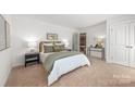 Comfortable bedroom with an ensuite bathroom, generous closet space, and neutral color scheme at 9239 Delancey Nw Ln, Concord, NC 28027