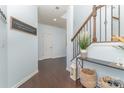 Stylish entryway with hardwood floors, decorative elements, and staircase leading to upper level at 1037 Delridge St, Waxhaw, NC 28173