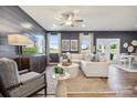 Stylish living room with modern furniture, a ceiling fan, and plenty of natural light at 1048 Arundle Rd, Sherrills Ford, NC 28673