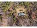 Birds-eye view of home nestled in secluded wooded lot for maximum privacy from the outside world at 12538 Sam Furr Rd, Huntersville, NC 28146