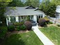 Attractive home boasting a well-maintained lawn and landscaped garden surrounding a cozy residence at 1519 The Plz, Charlotte, NC 28205