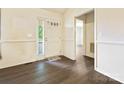 Bright entryway featuring wood-look flooring, a front door with glass, and neutral walls at 1520 Venture Oaks Ln, Monroe, NC 28110