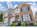 Charming two-story home with a brick facade and well-manicured landscaping at 1857 Felts Pkwy, Fort Mill, SC 29715