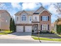 Beautiful two-story home with a two car garage and manicured front yard at 1857 Felts Pkwy, Fort Mill, SC 29715