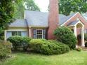 Charming brick home with a well-manicured front yard and mature landscaping at 2815 Glendale Rd, Charlotte, NC 28209