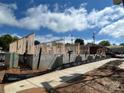 New home construction showing foundation, framing, and erosion defense along the perimeter on a sunny day at 3003 Casting St # 12, Charlotte, NC 28206