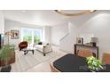 Bright living room with large windows, modern furnishings, and an open floor plan at 3003 Casting St # 12, Charlotte, NC 28206